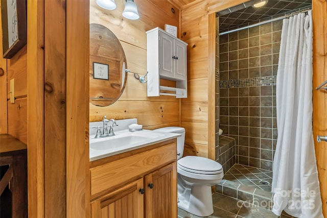 279 Outback Trl, Nebo, NC 28761 - full bathroom featuring vanity, tiled shower, wooden walls, and tile patterned flooring