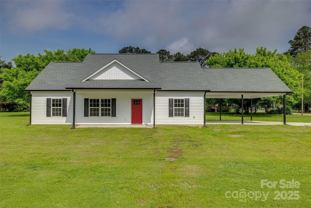 521 Tram Rd, Lancaster, SC 29720 - view of front of home featuring a front lawn, a carport, and a shingled roof