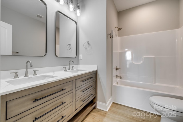 521 Tram Rd, Lancaster, SC 29720 - bathroom with wood finished floors, shower / bathtub combination, and double vanity