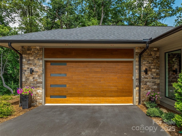 23 Haverhill Ct, Flat Rock, NC 28731 - garage featuring asphalt driveway