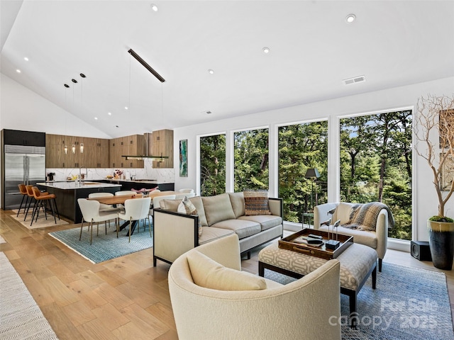 23 Haverhill Ct, Flat Rock, NC 28731 - living area with light wood-style floors, recessed lighting, and high vaulted ceiling