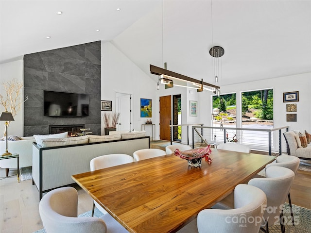 23 Haverhill Ct, Flat Rock, NC 28731 - dining area with light wood finished floors, high vaulted ceiling, and recessed lighting