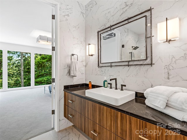 23 Haverhill Ct, Flat Rock, NC 28731 - bathroom featuring vanity, marble finish flooring, and tile walls