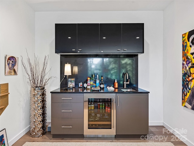 23 Haverhill Ct, Flat Rock, NC 28731 - indoor bar featuring wine cooler, tasteful backsplash, and wood finished floors