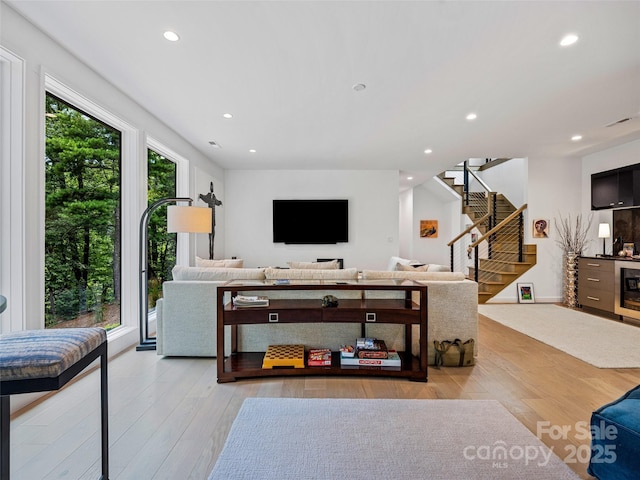 23 Haverhill Ct, Flat Rock, NC 28731 - living room with stairs, recessed lighting, wood finished floors, and wine cooler