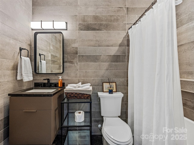23 Haverhill Ct, Flat Rock, NC 28731 - bathroom with vanity, a shower with shower curtain, and tile walls