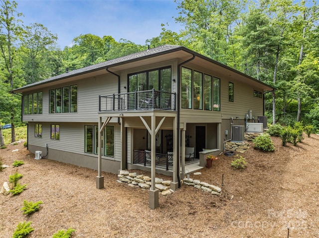 23 Haverhill Ct, Flat Rock, NC 28731 - rear view of property featuring a balcony