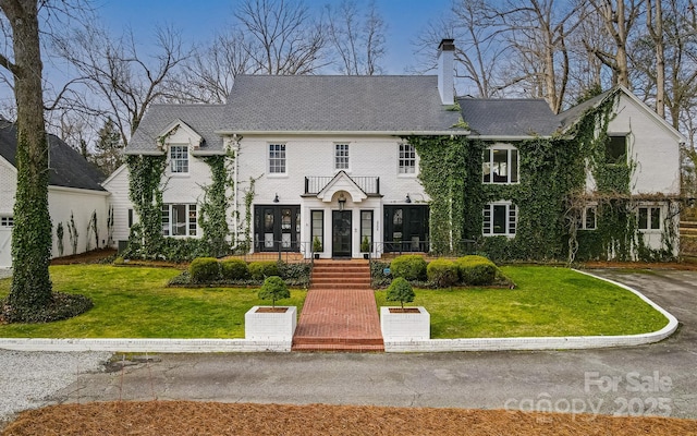 3306 Gaston Rd, Greensboro, NC 27407 - view of front of property featuring a chimney and a front yard