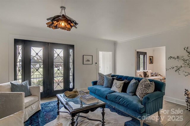 3306 Gaston Rd, Greensboro, NC 27407 - living room featuring french doors and light wood-style floors
