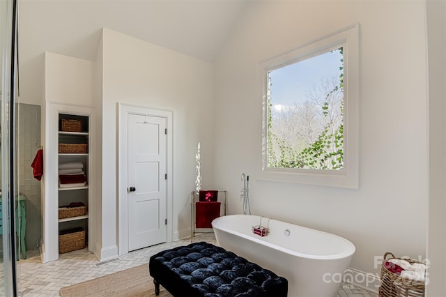 3306 Gaston Rd, Greensboro, NC 27407 - bathroom with a freestanding bath and lofted ceiling