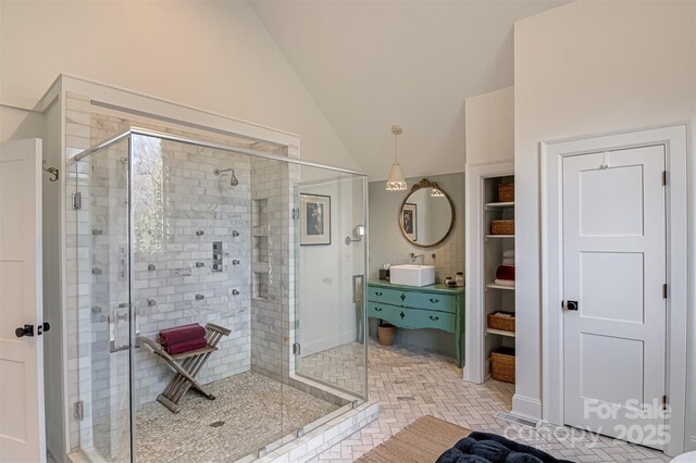 3306 Gaston Rd, Greensboro, NC 27407 - full bathroom with a shower stall, vaulted ceiling, and vanity