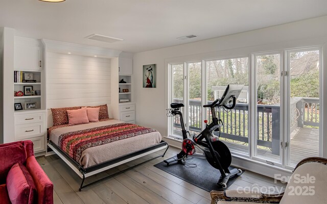 3306 Gaston Rd, Greensboro, NC 27407 - bedroom with access to exterior and hardwood / wood-style flooring