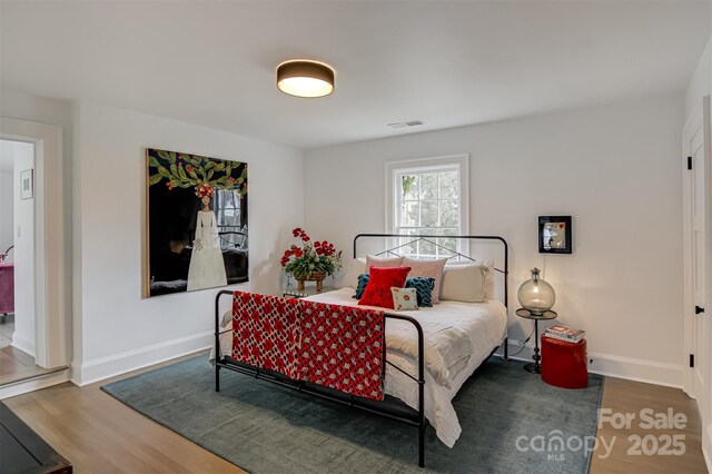 3306 Gaston Rd, Greensboro, NC 27407 - bedroom with wood finished floors and baseboards