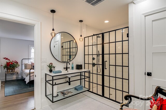 3306 Gaston Rd, Greensboro, NC 27407 - ensuite bathroom featuring a shower stall, vanity, wood finished floors, and recessed lighting