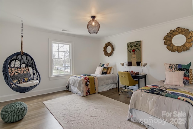 3306 Gaston Rd, Greensboro, NC 27407 - bedroom with ornamental molding and wood finished floors