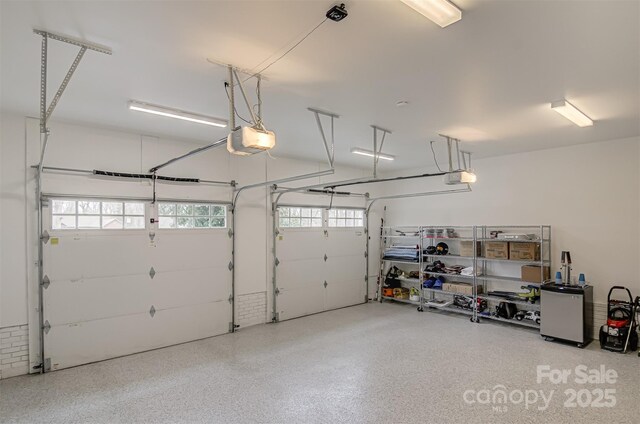 3306 Gaston Rd, Greensboro, NC 27407 - garage featuring a garage door opener