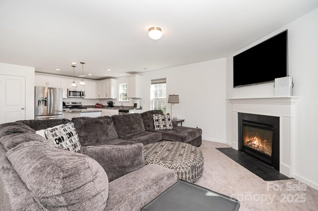 1026 Baileys Chapel Rd, Advance, NC 27006 - carpeted living room with a fireplace with flush hearth and recessed lighting