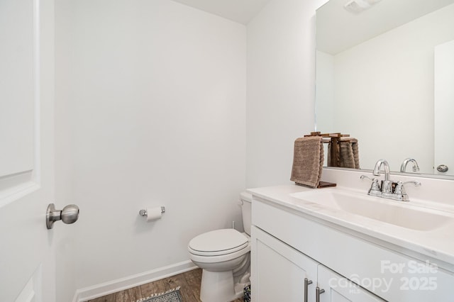 1026 Baileys Chapel Rd, Advance, NC 27006 - half bath with vanity and wood finished floors