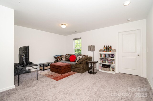 1026 Baileys Chapel Rd, Advance, NC 27006 - carpeted living area with baseboards