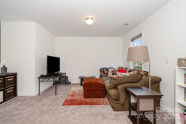 1026 Baileys Chapel Rd, Advance, NC 27006 - carpeted living room with baseboards