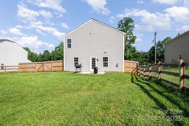 1026 Baileys Chapel Rd, Advance, NC 27006 - rear view of house featuring a fenced backyard and a patio
