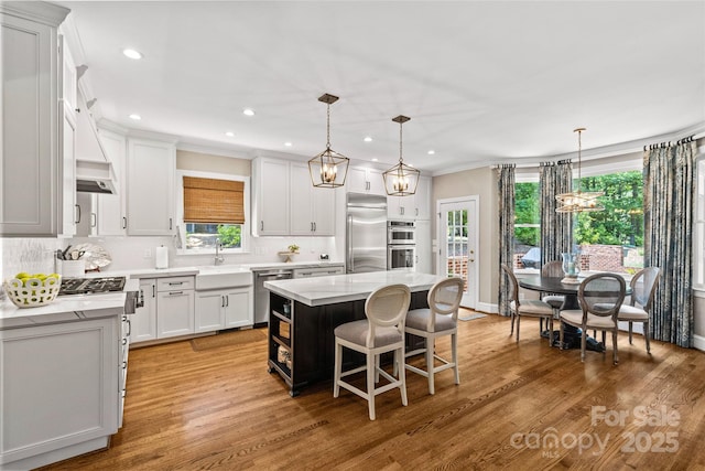 6716 Southby Ct, Charlotte, NC 28270 - kitchen featuring stainless steel appliances, light countertops, decorative backsplash, recessed lighting, and crown molding