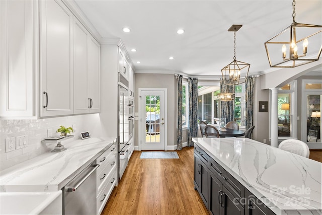 6716 Southby Ct, Charlotte, NC 28270 - kitchen featuring a chandelier, dishwasher, recessed lighting, light wood finished floors, and white cabinetry