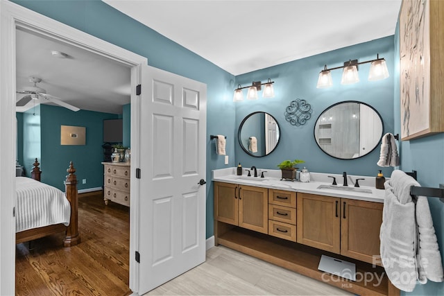 6716 Southby Ct, Charlotte, NC 28270 - bathroom with wood finished floors, double vanity, ceiling fan, and ensuite bathroom