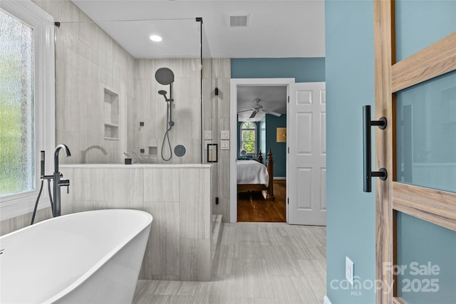 6716 Southby Ct, Charlotte, NC 28270 - bathroom featuring a shower stall, a freestanding bath, ensuite bathroom, and ceiling fan