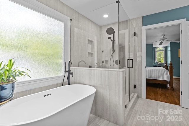 6716 Southby Ct, Charlotte, NC 28270 - bathroom featuring a stall shower, a freestanding bath, a ceiling fan, and ensuite bath