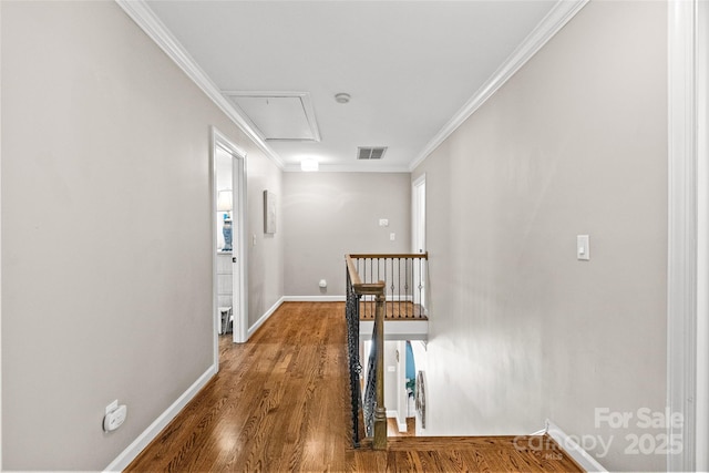 6716 Southby Ct, Charlotte, NC 28270 - hallway with attic access, wood finished floors, crown molding, and an upstairs landing