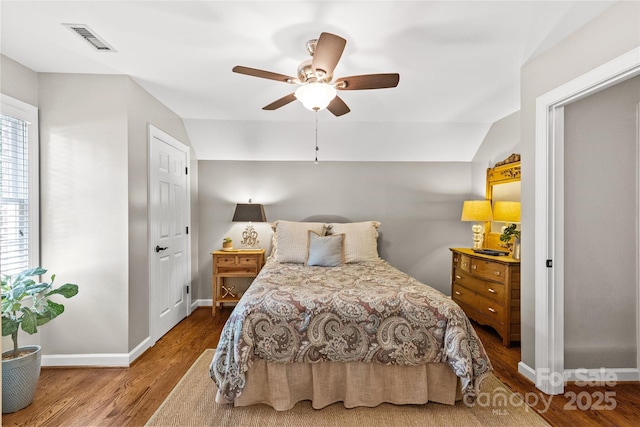 6716 Southby Ct, Charlotte, NC 28270 - bedroom featuring wood finished floors, a ceiling fan, and lofted ceiling
