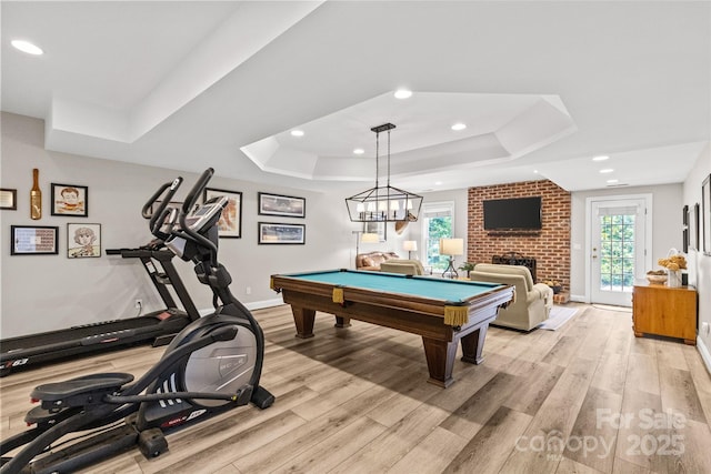 6716 Southby Ct, Charlotte, NC 28270 - recreation room with a raised ceiling, light wood-style floors, recessed lighting, pool table, and a brick fireplace