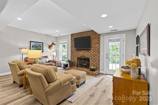 6716 Southby Ct, Charlotte, NC 28270 - living area with light wood-style floors, plenty of natural light, a fireplace, and recessed lighting
