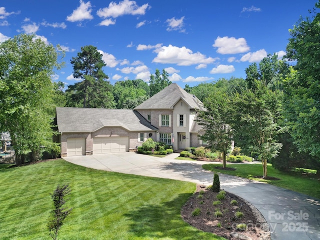 166 Atlantic Way, Mooresville, NC 28117 - view of front facade with concrete driveway, a front lawn, a garage, and brick siding