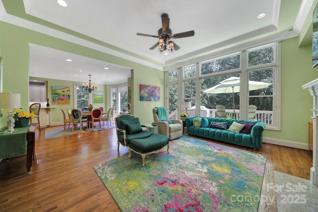 166 Atlantic Way, Mooresville, NC 28117 - living area featuring a ceiling fan, wood finished floors, a chandelier, recessed lighting, and crown molding