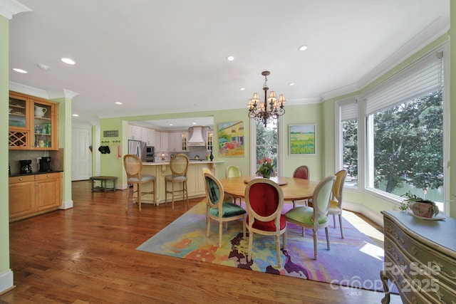 166 Atlantic Way, Mooresville, NC 28117 - dining area with crown molding, a chandelier, recessed lighting, and dark wood finished floors
