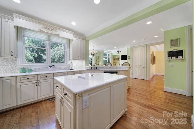 166 Atlantic Way, Mooresville, NC 28117 - kitchen with a peninsula, decorative backsplash, plenty of natural light, and recessed lighting