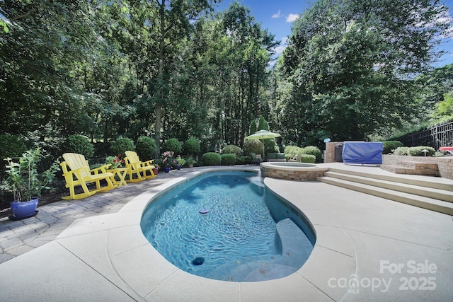 166 Atlantic Way, Mooresville, NC 28117 - view of swimming pool featuring a patio, a pool with connected hot tub, and view of scattered trees