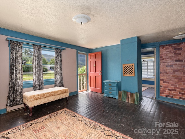 51 Riverbend St, Waynesville, NC 28786 - sitting room with a textured ceiling, healthy amount of natural light, and wood-type flooring