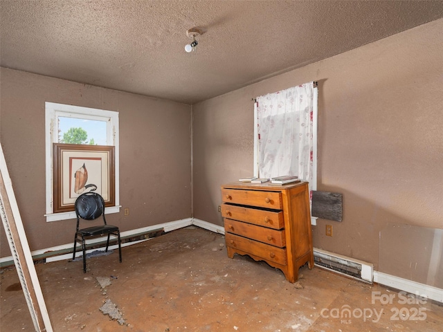 51 Riverbend St, Waynesville, NC 28786 - bedroom with baseboard heating and a textured ceiling