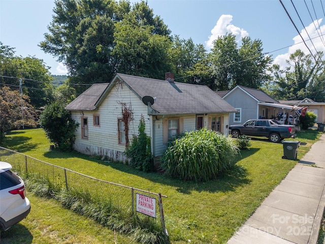 51 Riverbend St, Waynesville, NC 28786 - view of front of house featuring a chimney and a shingled roof
