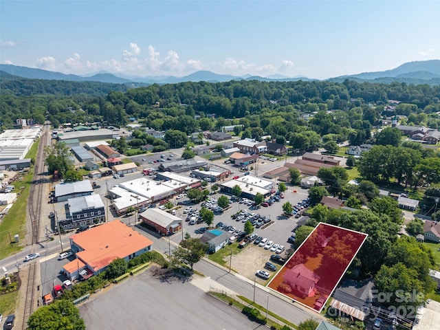 51 Riverbend St, Waynesville, NC 28786 - aerial overview of property's location with a mountain backdrop and property boundaries highlighted
