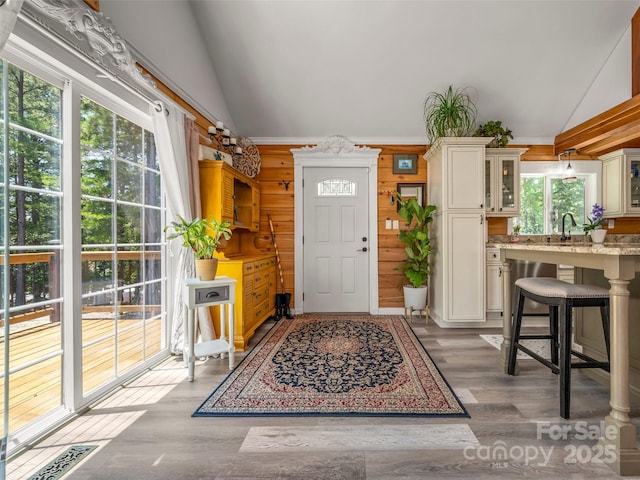 334 Arbra Mountain Way, Bostic, NC 28018 - entrance foyer featuring healthy amount of natural light, high vaulted ceiling, light wood-style floors, and wooden walls