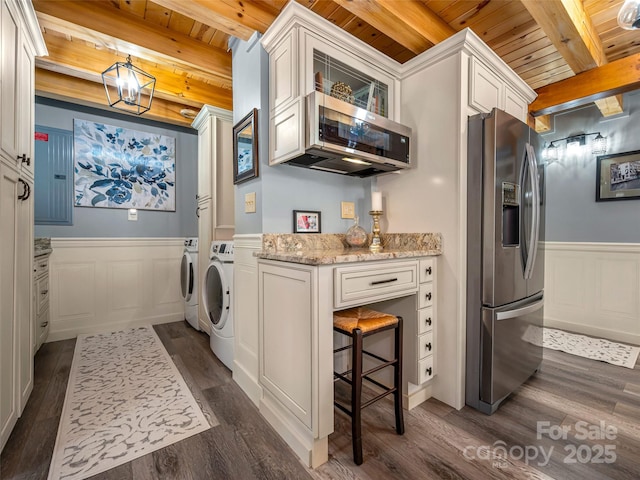 334 Arbra Mountain Way, Bostic, NC 28018 - washroom with wood ceiling, dark wood-type flooring, washing machine and dryer, a decorative wall, and a wainscoted wall