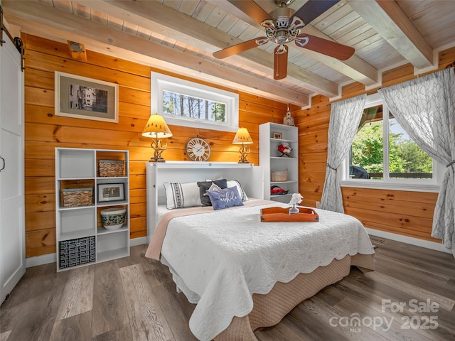334 Arbra Mountain Way, Bostic, NC 28018 - bedroom featuring wooden walls, wood finished floors, a wooden ceiling with exposed beams, and a barn door