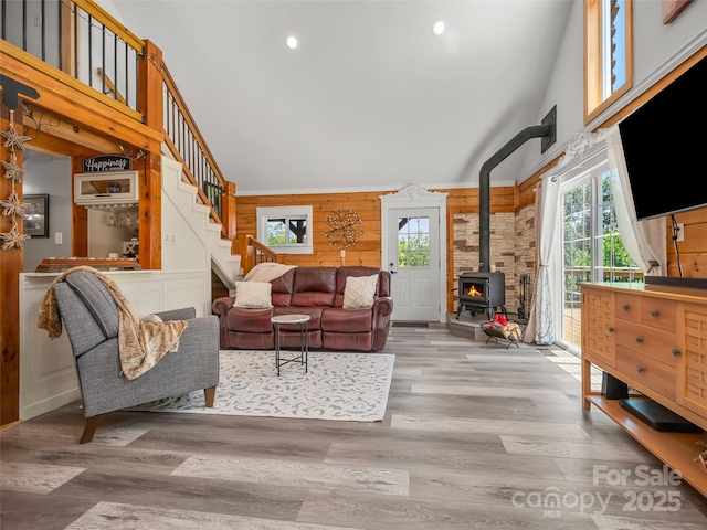 334 Arbra Mountain Way, Bostic, NC 28018 - living room with high vaulted ceiling, plenty of natural light, a wood stove, stairway, and recessed lighting