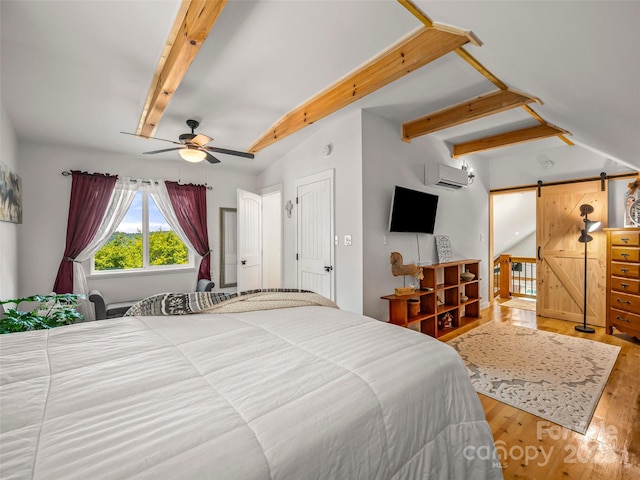334 Arbra Mountain Way, Bostic, NC 28018 - bedroom with an AC wall unit, a barn door, beamed ceiling, wood finished floors, and a ceiling fan