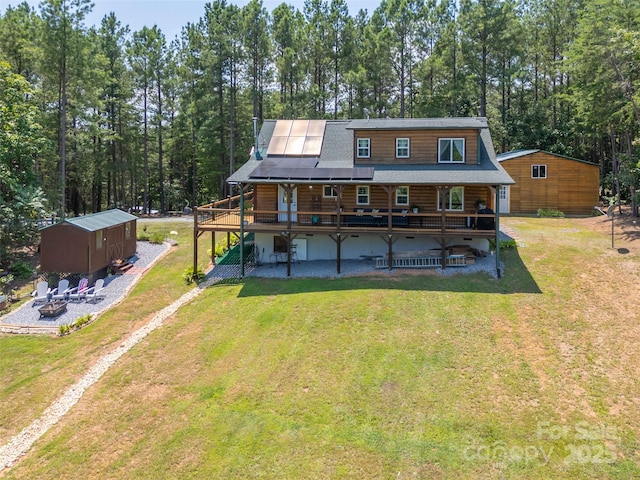 334 Arbra Mountain Way, Bostic, NC 28018 - rear view of property with a fire pit, log exterior, a lawn, and driveway