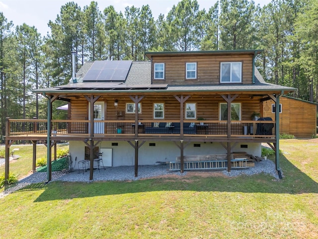 334 Arbra Mountain Way, Bostic, NC 28018 - rear view of house with roof mounted solar panels, log siding, a lawn, a patio, and a deck